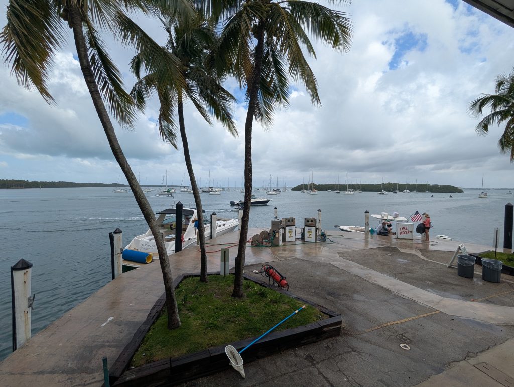 Fuel and water station at Crandon Park Marina with boats docked and Key Biscayne in the background