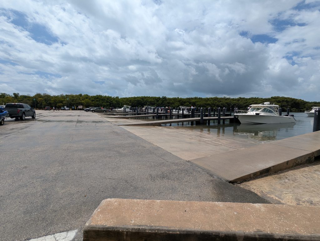 Wide angle of Crandon Marina boat ramp lanes and dock